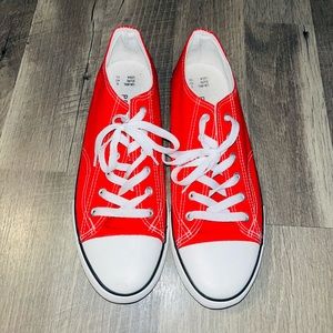 Red converse like shoes.